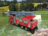 Spielauto Feuerwehr-LKW mit Drehleiter rot/grau 21cm Metall Kartonetui