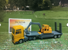 1611 - Tieflader mit Bagger,neu in OVP,Siku Blister